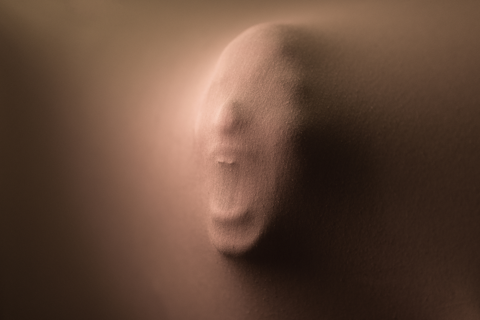 person sitting on a couch experiencing pain